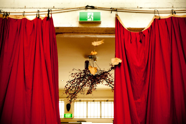 Red Velvet Curtains Autumn Leaves Exit Sign